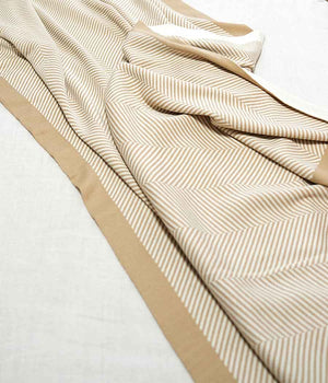 Throw blanket in brown beige with stripe patterns | opened