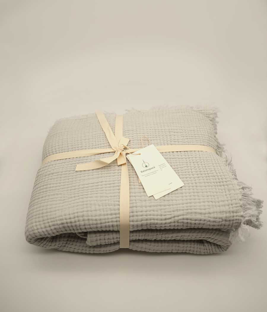 Cotton throw blanket in silver grey folded