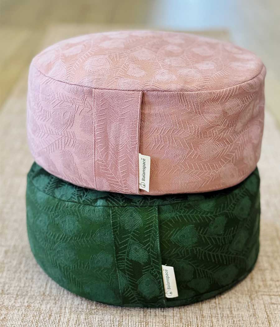 Vintage jacquard Zafu meditation cushion in pink velvet on top of green cushion